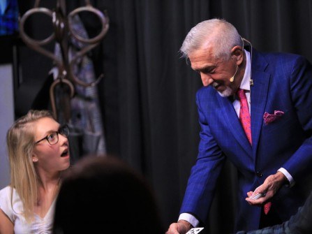 boB performing close-up magic at a table