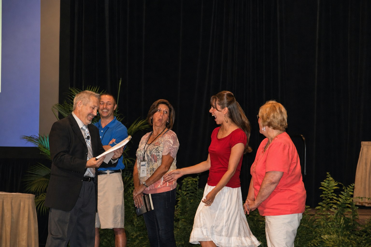 boB sharing an entertaining moment with guests at an event