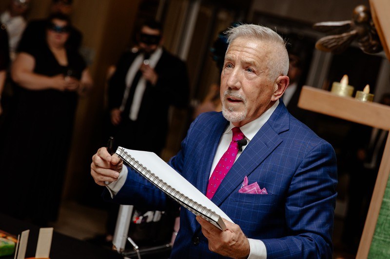 boB entertaining guests at a formal evening event