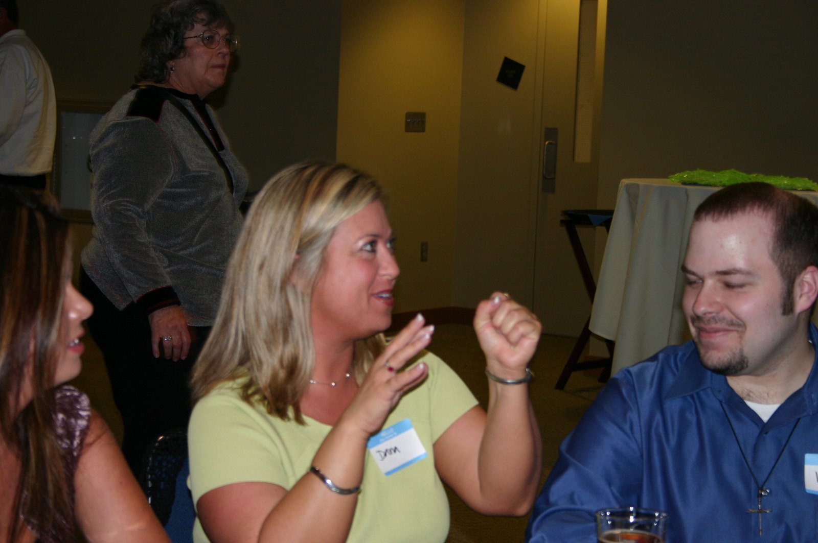 Guests gathered around a close-up performance at an event