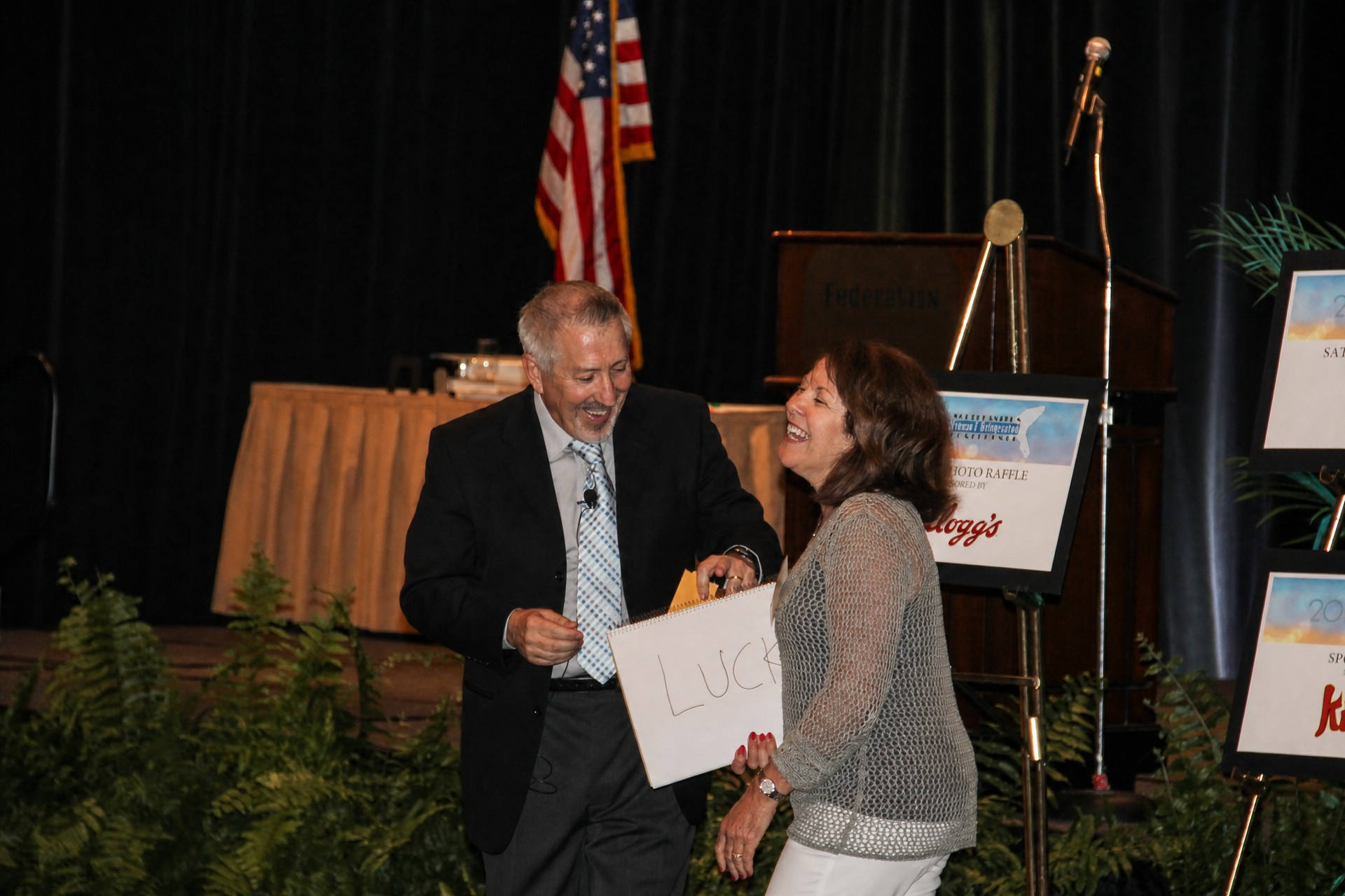boB sharing a winning moment with a guest on stage