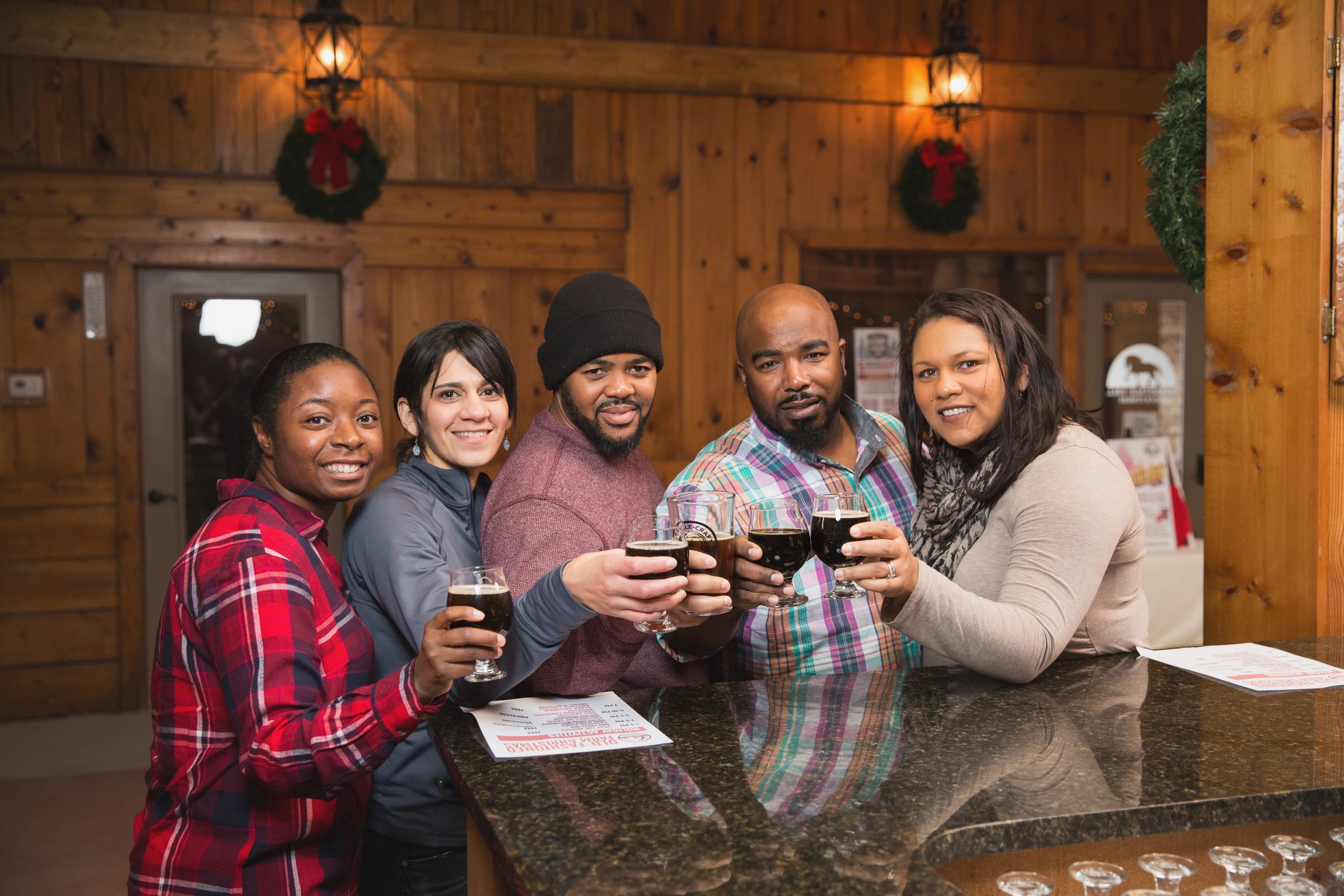 Colleagues celebrating together during the holidays at Stable Craft Brewing