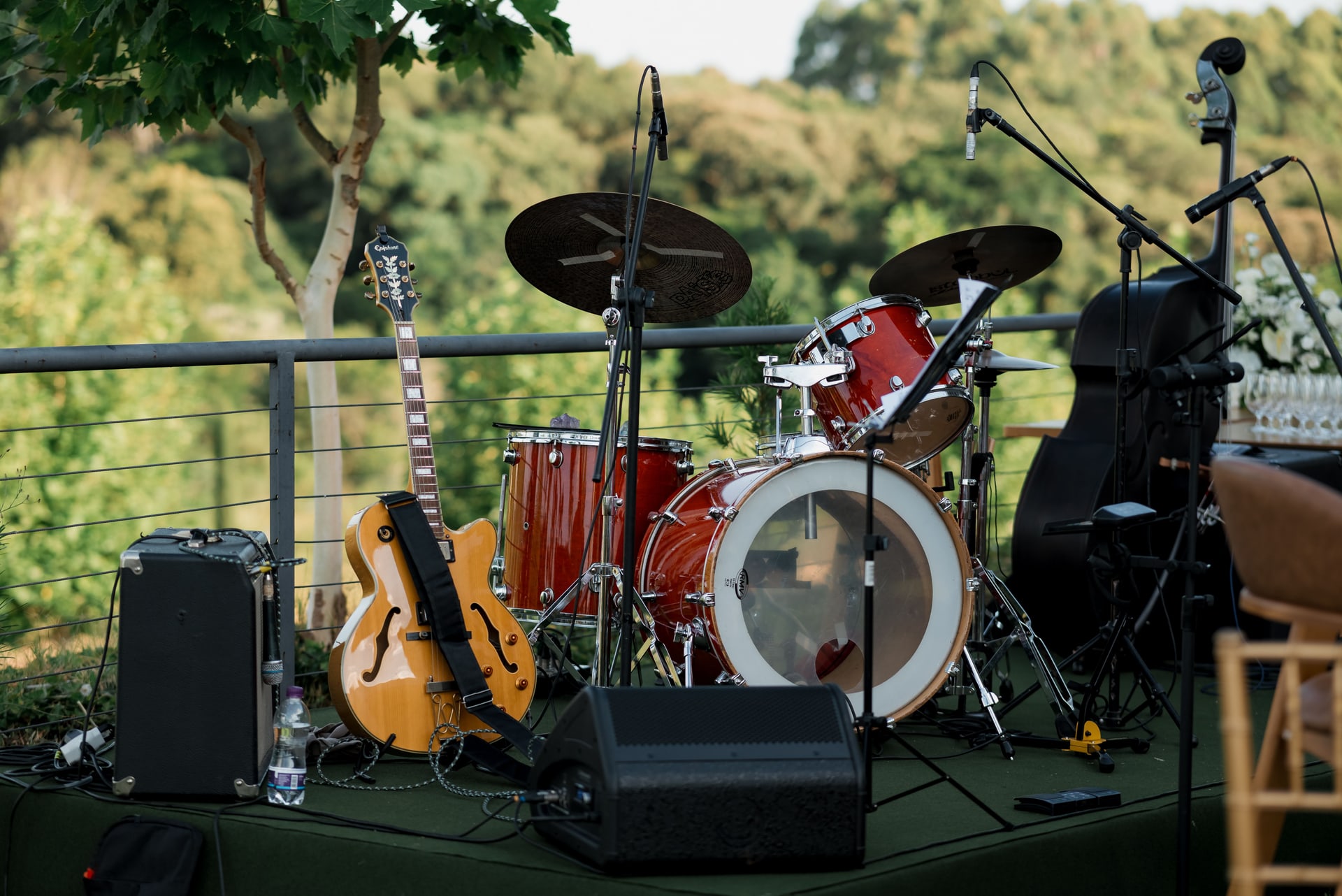 Outdoor music stage set with a guitar and drum kit