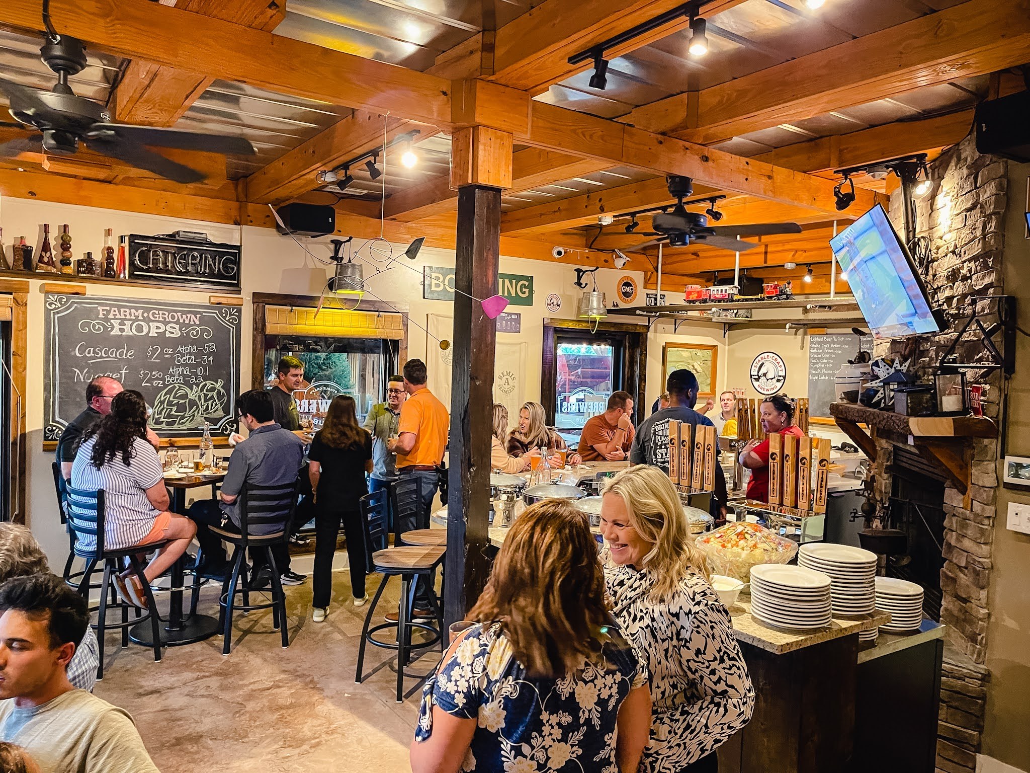 Guests celebrating in the Brewers Club at Stable Craft