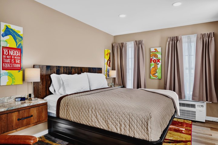 Meadow Summit · Loft 202: Bedroom with colorful artwork
