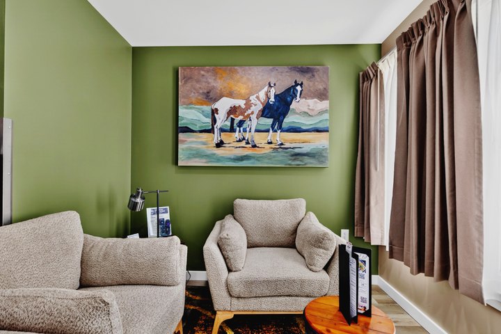 Horizon Overlook · Loft 205: Sitting area beneath horse artwork
