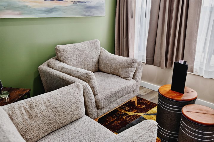 Horizon Overlook · Loft 205: Armchairs and side tables beside the window