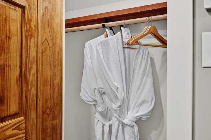 Horizon Overlook · Loft 205: Guest robes hanging beside the bathroom