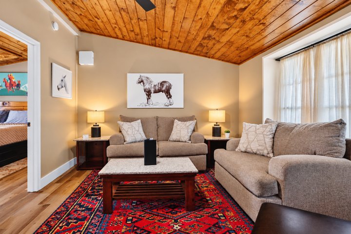 Crestwood: Living room with sofas and timber ceiling