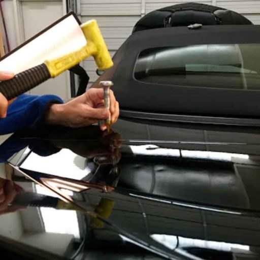 Vehicle panel before paintless dent repair