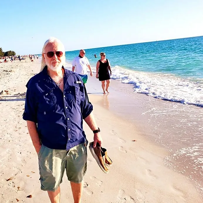 G.J. Dürrschmidt beachcombing along the shore