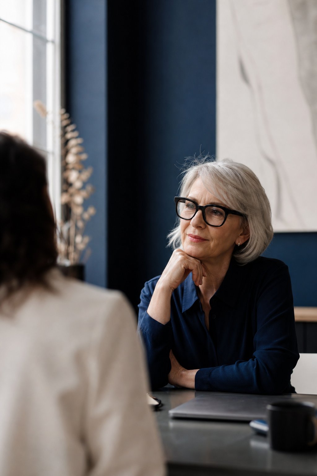A social media strategist in conversation with a colleague