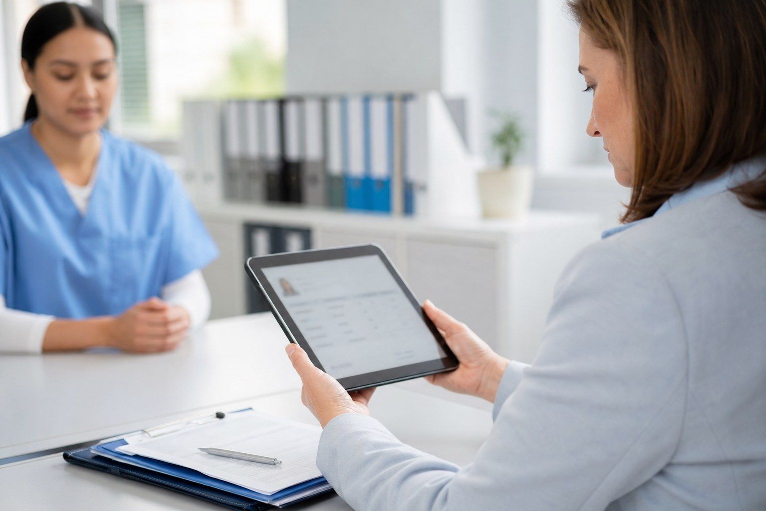 Healthcare professional reviewing a license record before placement