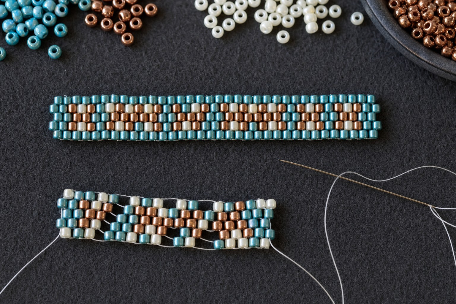 A flat even beadwork sample above a loose practice swatch on a dark bead mat