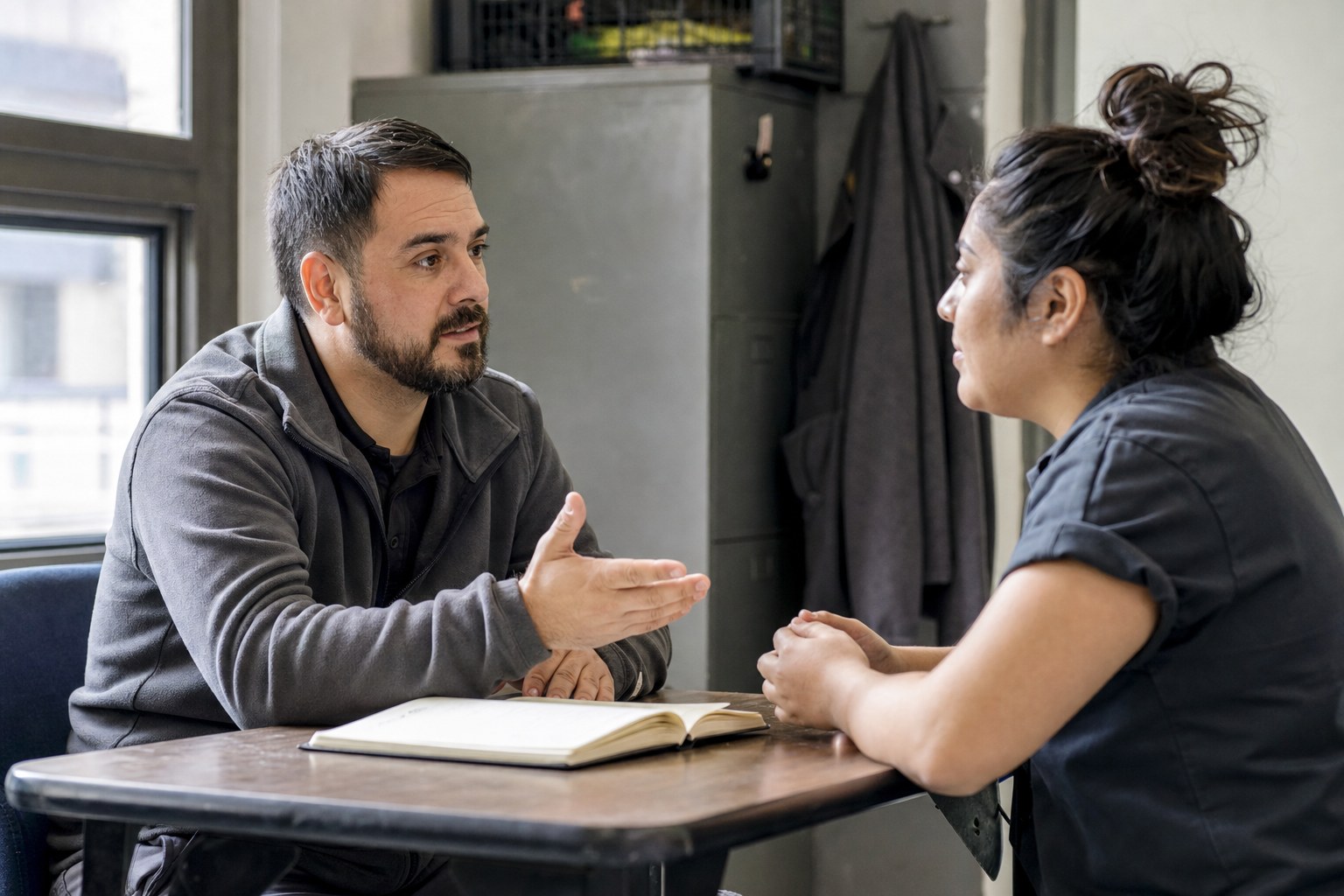 A supervisor having a focused one-on-one check-in with a team member.