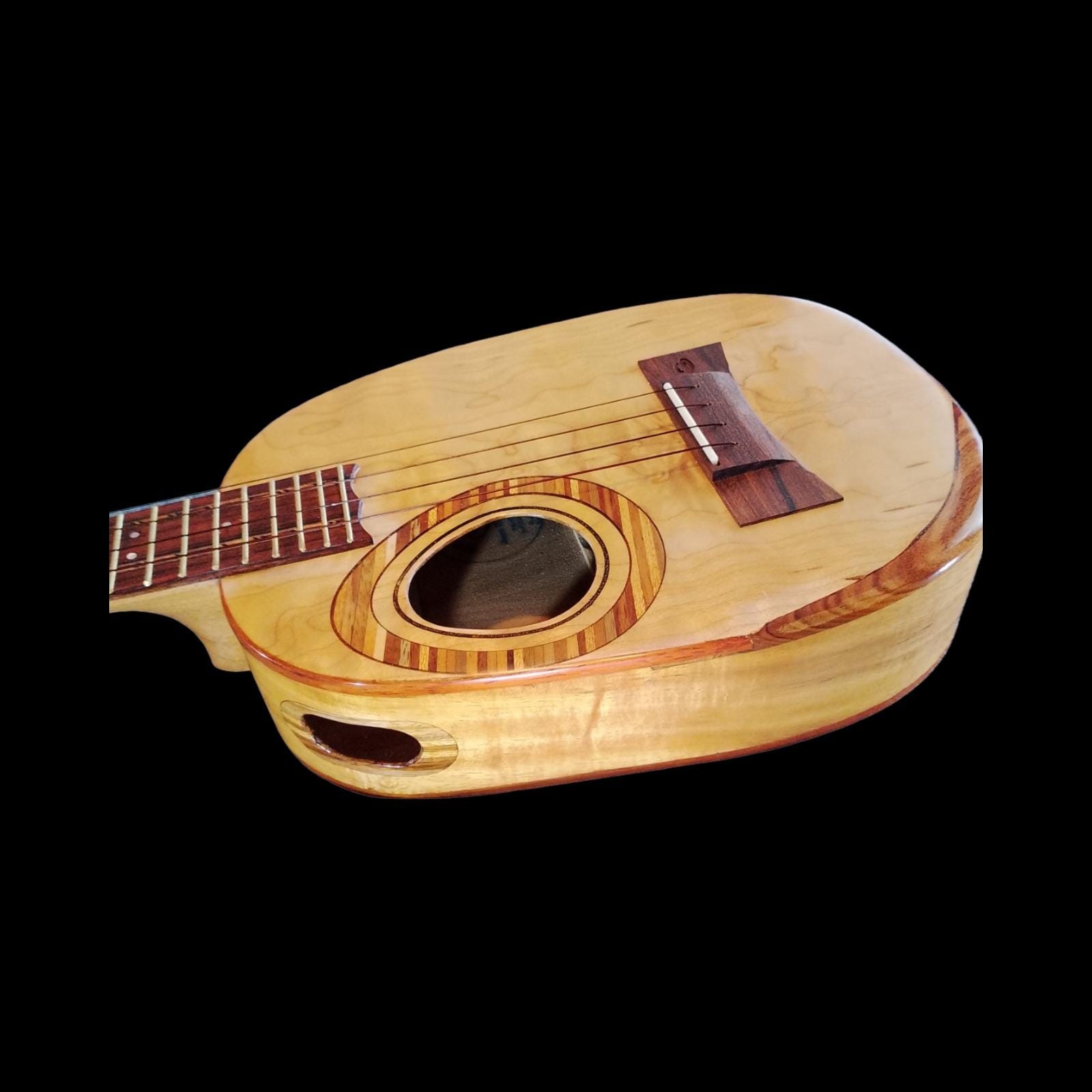 Flame maple top detail on koa tenor ukulele