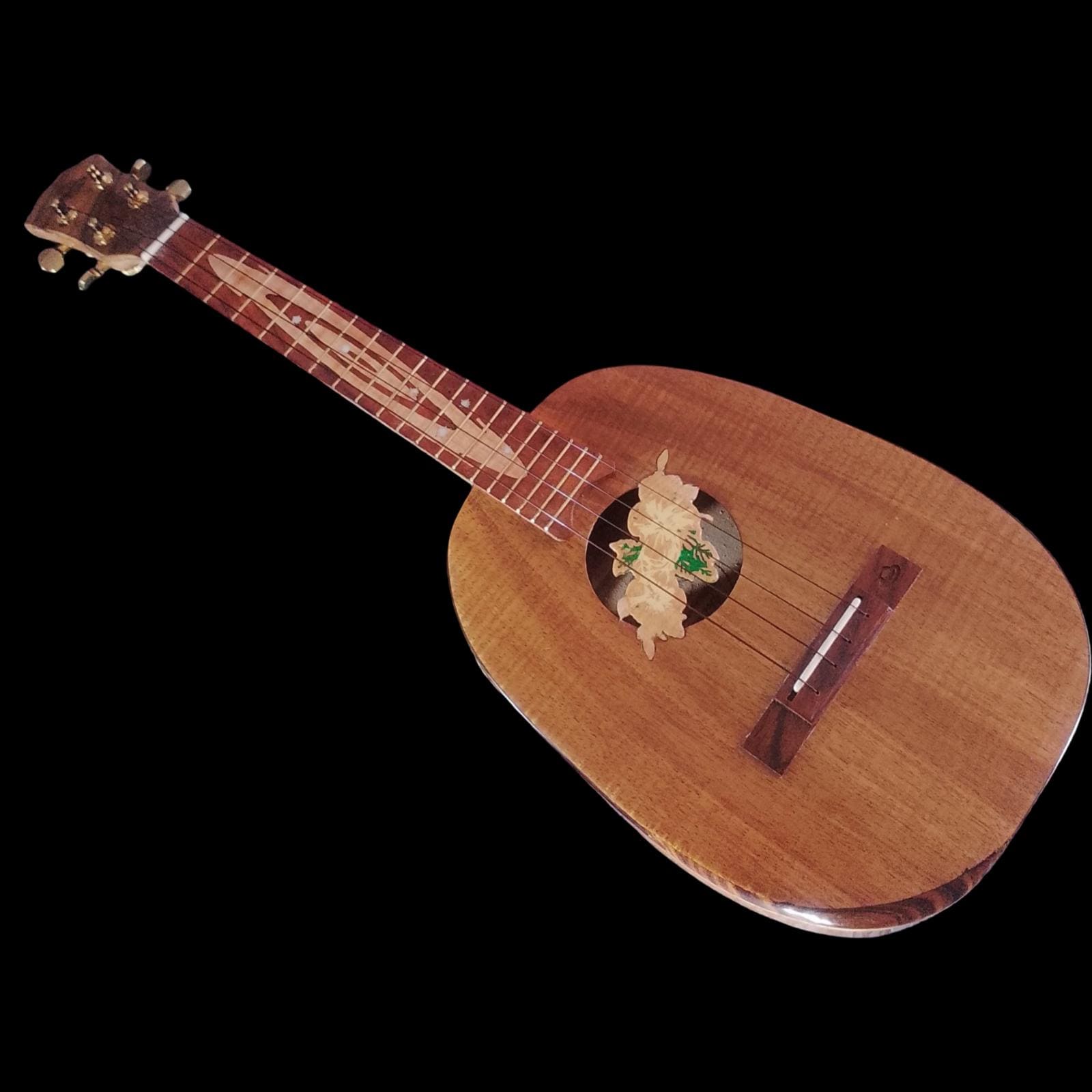 Solid koa pineapple tenor ukulele with raised hibiscus sound hole