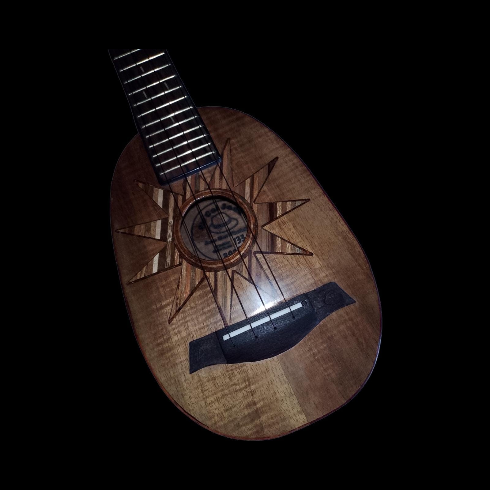 Detail of solid koa super soprano ukulele