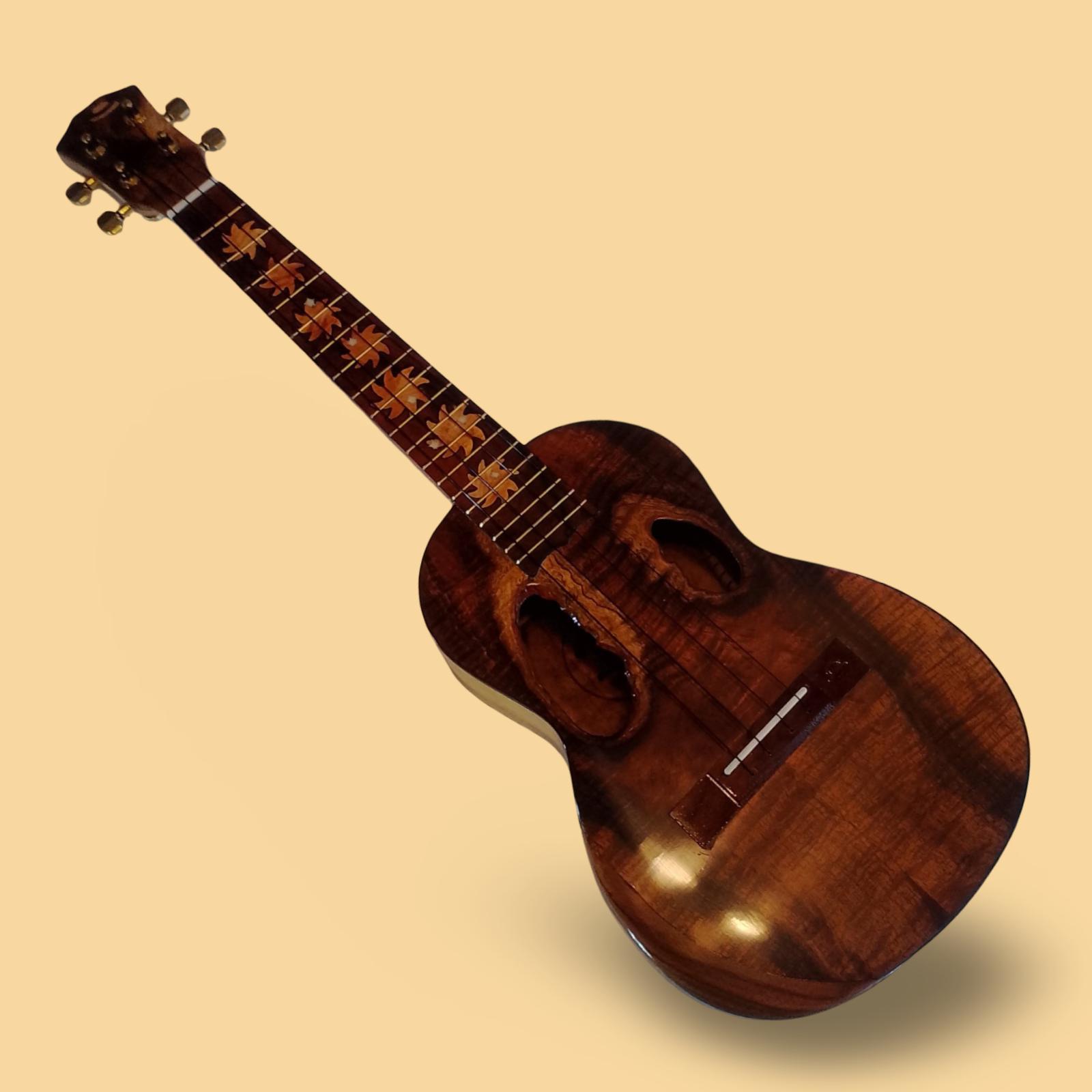 Koa tenor ukulele with two live-edge knot sound holes
