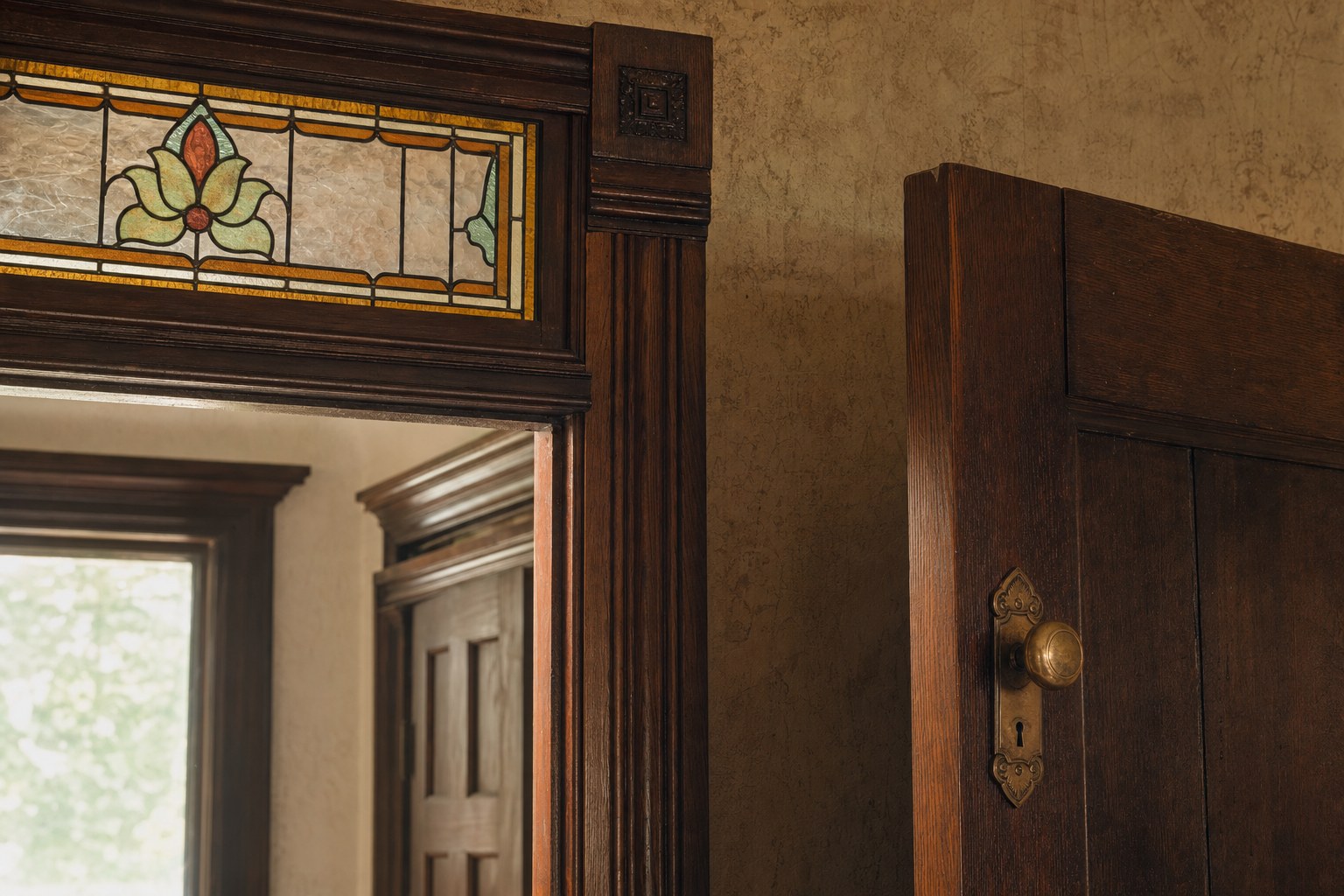 Illustrative stained glass and carved wood trim in an older home