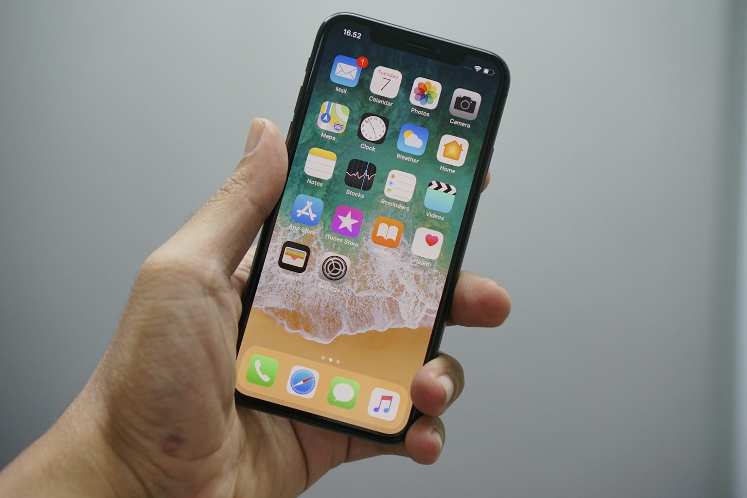Smartphone held ready to connect to a portable projector
