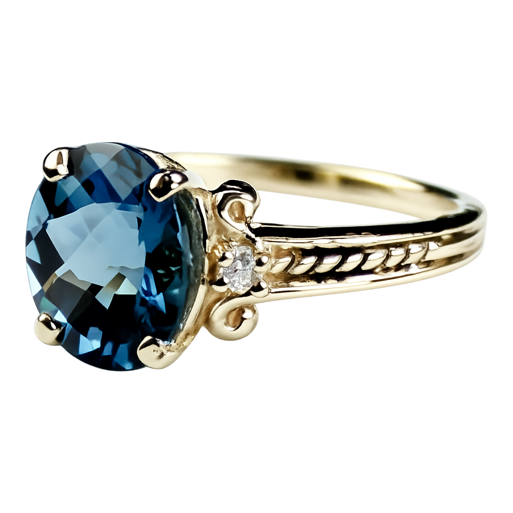 Gold ring with a blue gemstone and engraved band