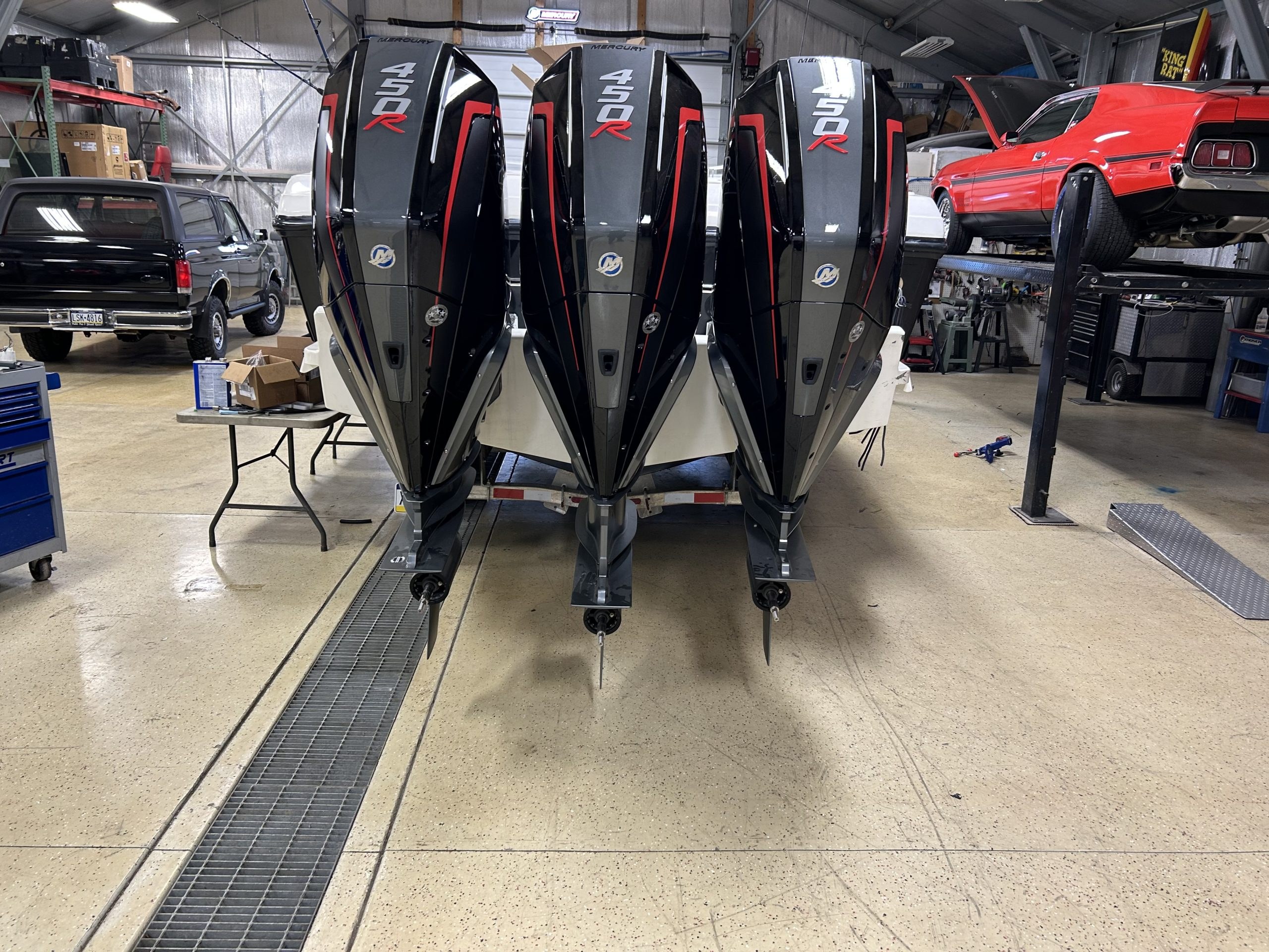 Four outboard engines in Blackbird Motors shop