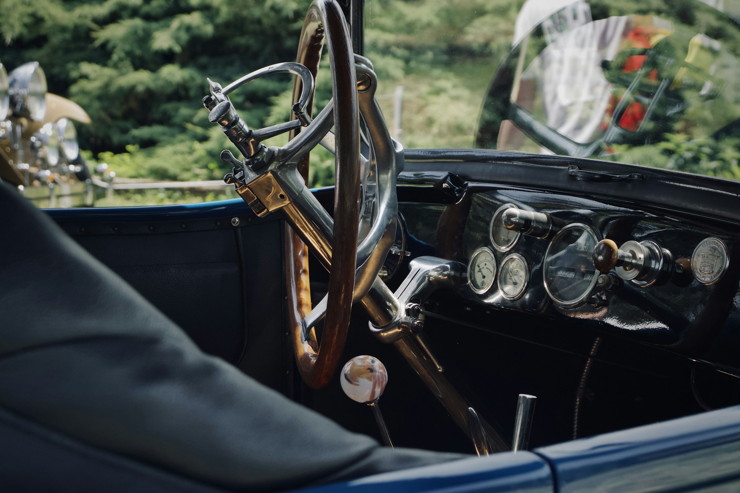 Classic car dashboard showing analog speedometer and gauges