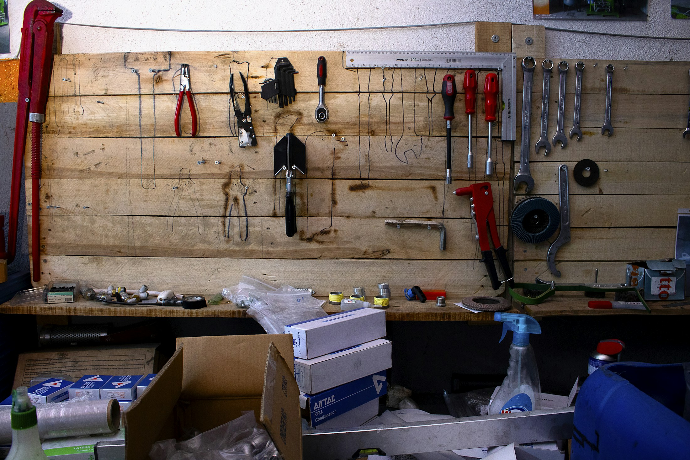Workbench wall with neatly arranged hand tools