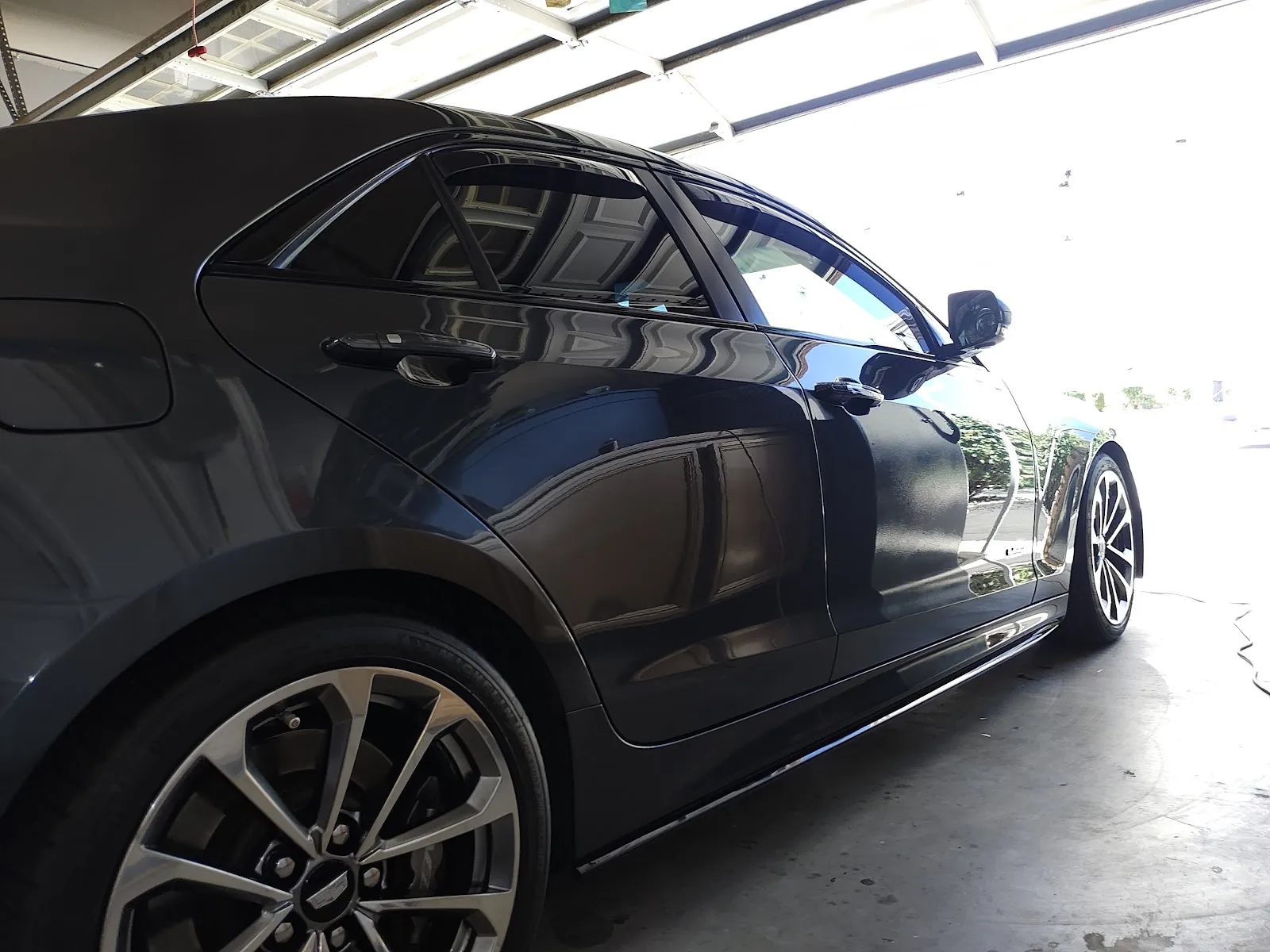 Black car in a garage after mobile detailing