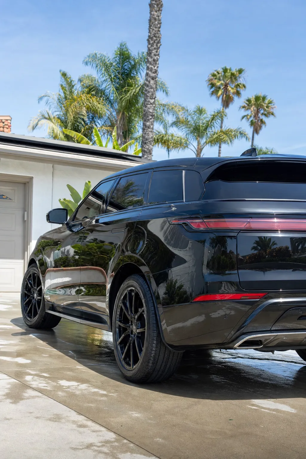 Freshly cleaned dark vehicle with a glossy exterior finish