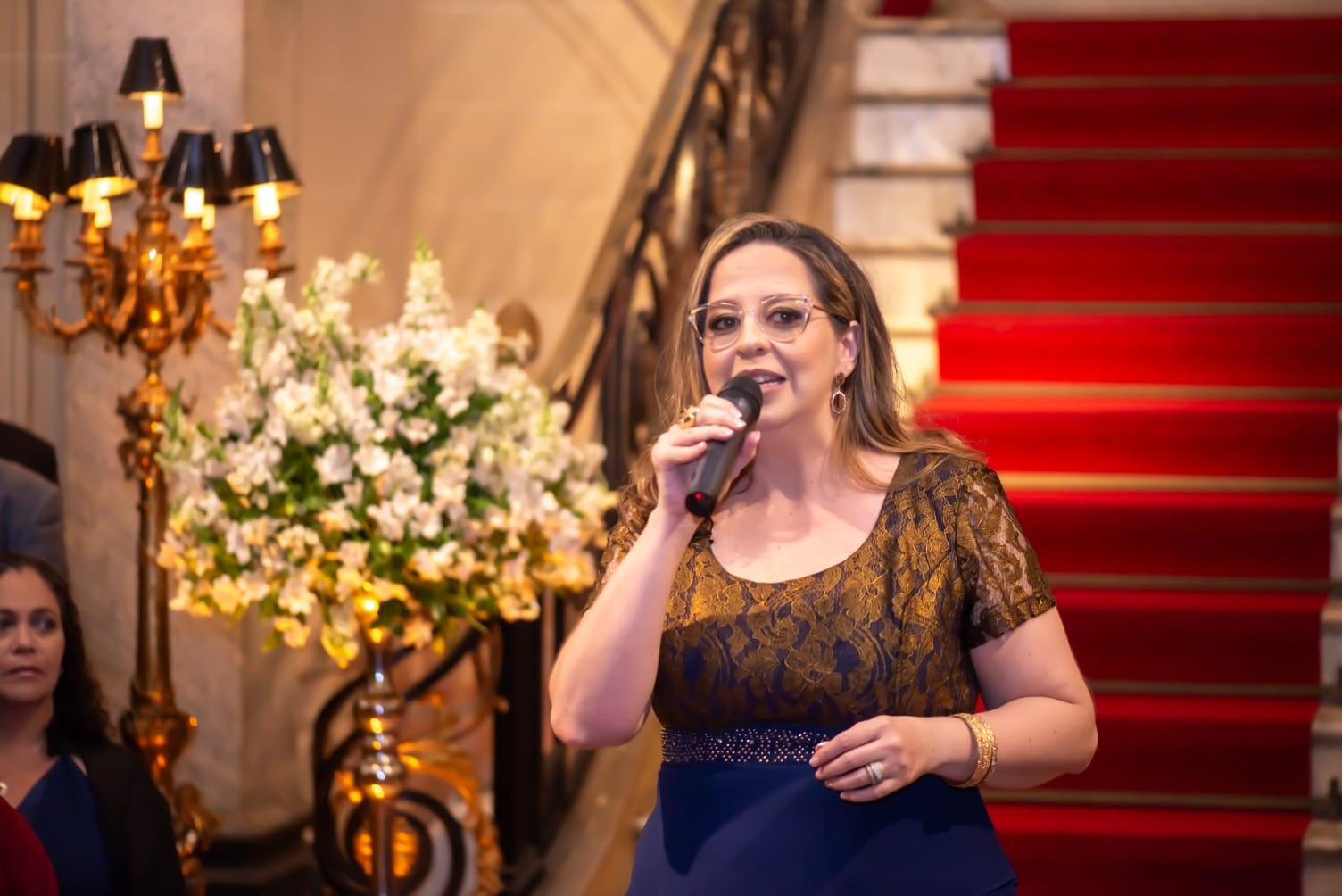 Carolina Dias Walley speaking at a wedding celebration