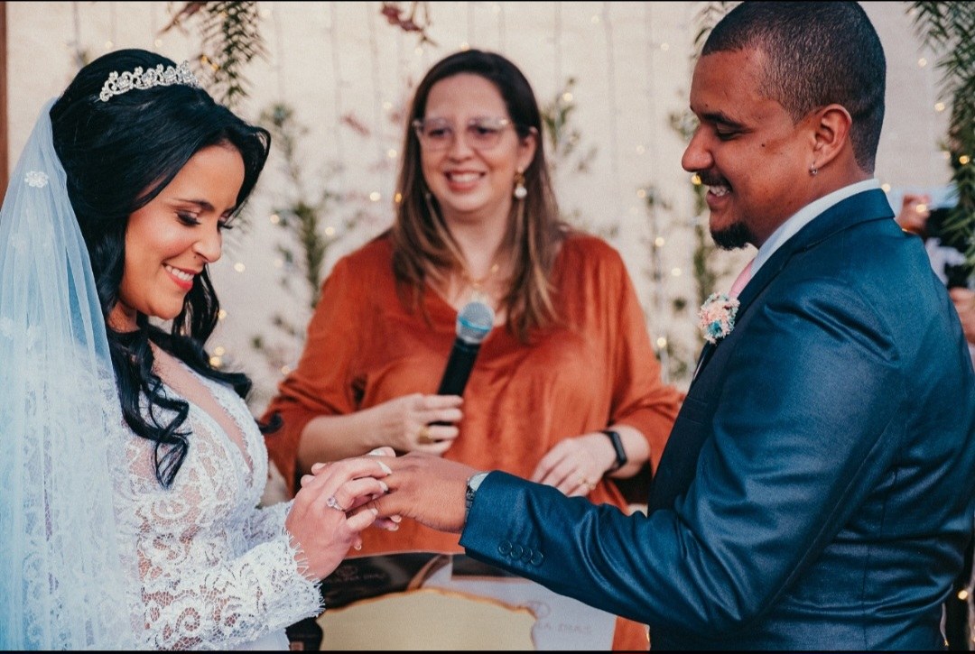 A couple exchanging rings during their ceremony