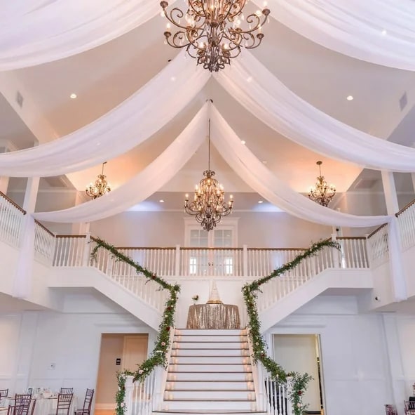 White ceiling fabric draping in a wedding venue