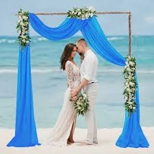 Green and white tent fabric draping with floral decor