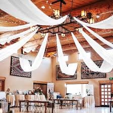Blue fabric tent draping over an outdoor reception