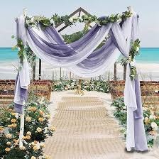 Beach wedding fabric draping with balloon decor