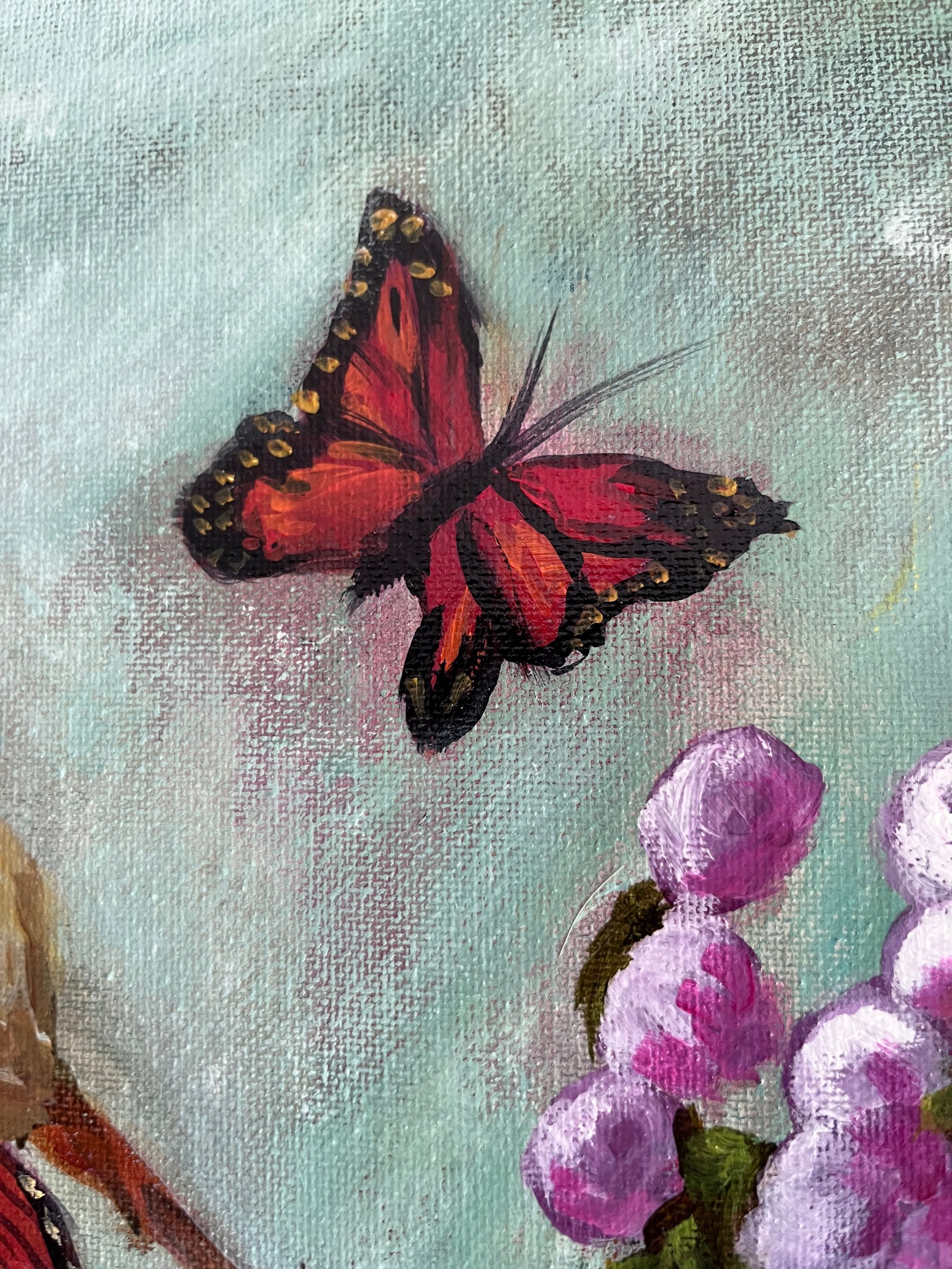 Close-up of a red-and-black butterfly above purple buds, showing paint layers and canvas texture