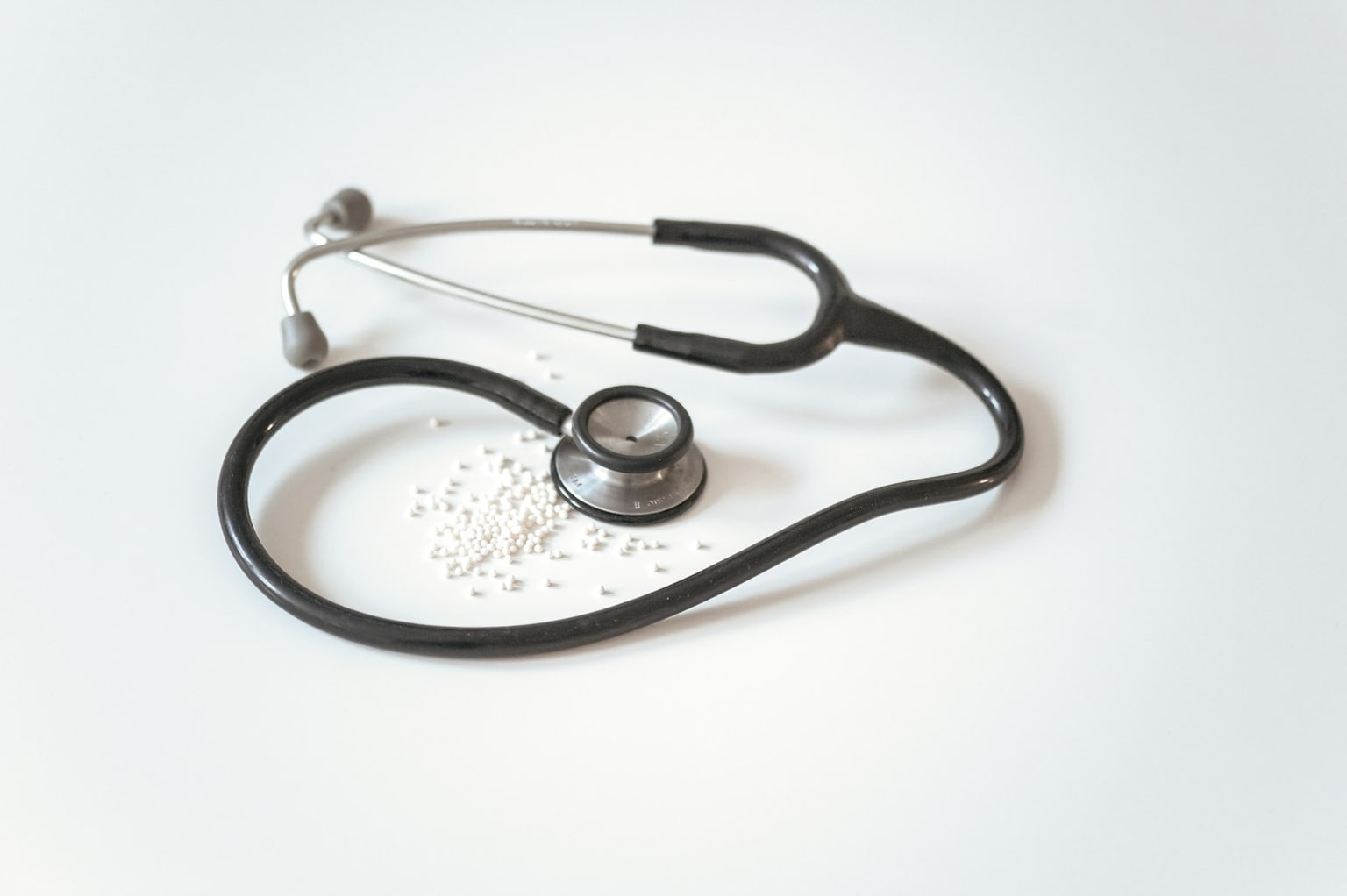Stethoscope on a clinical surface, representing careful qualification checks