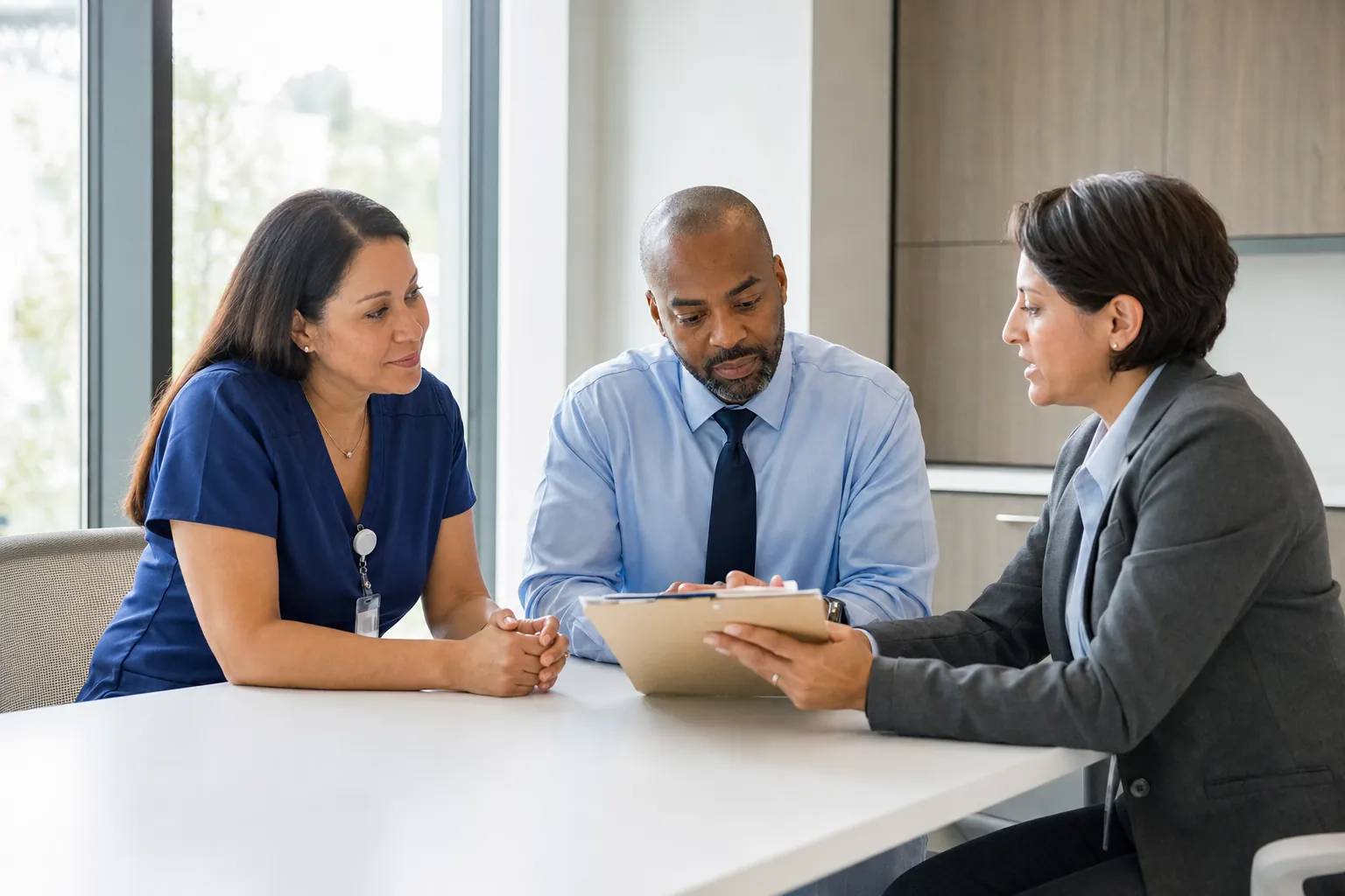 Healthcare leaders meeting with an executive search partner