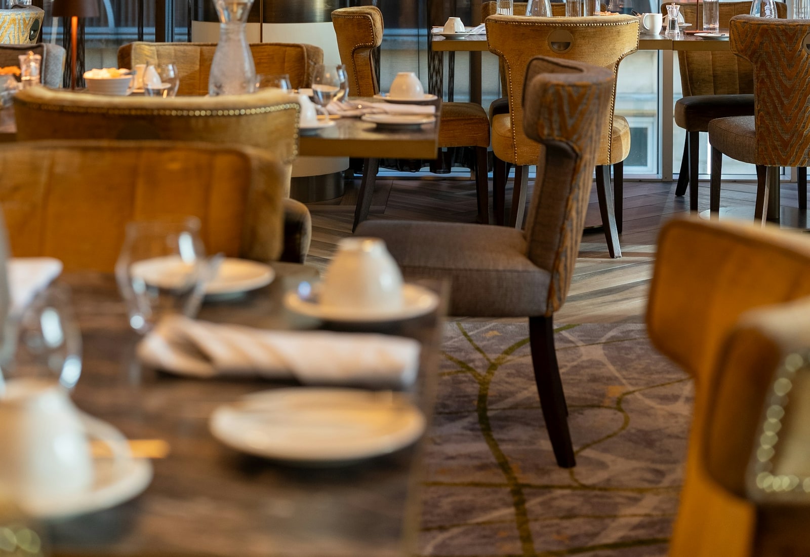 Warm restaurant dining room prepared for service