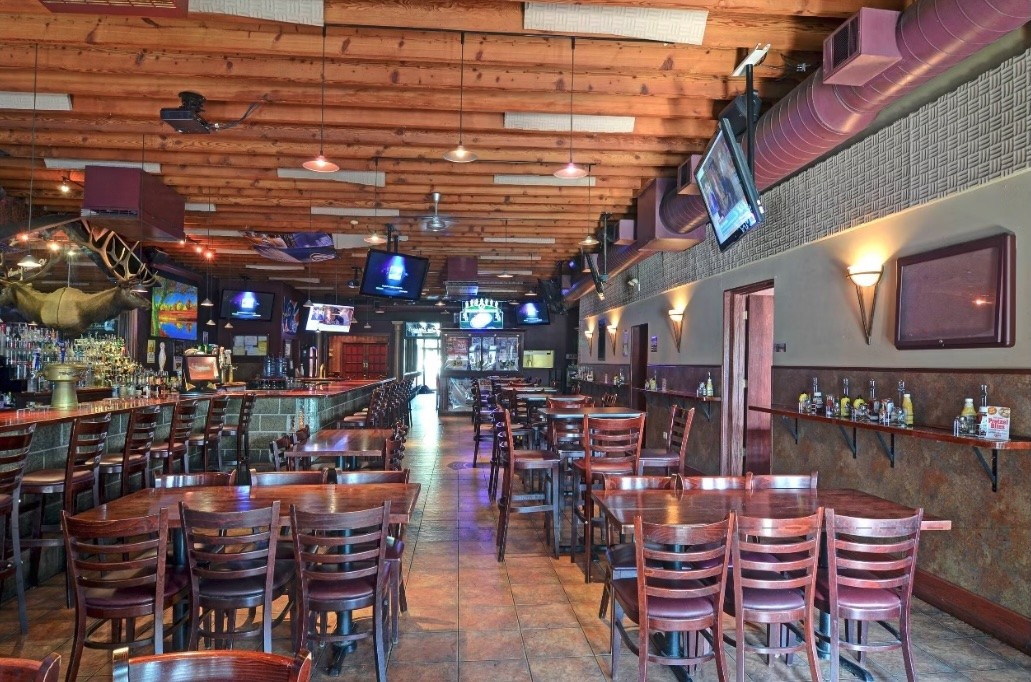 Warm restaurant dining room prepared for service