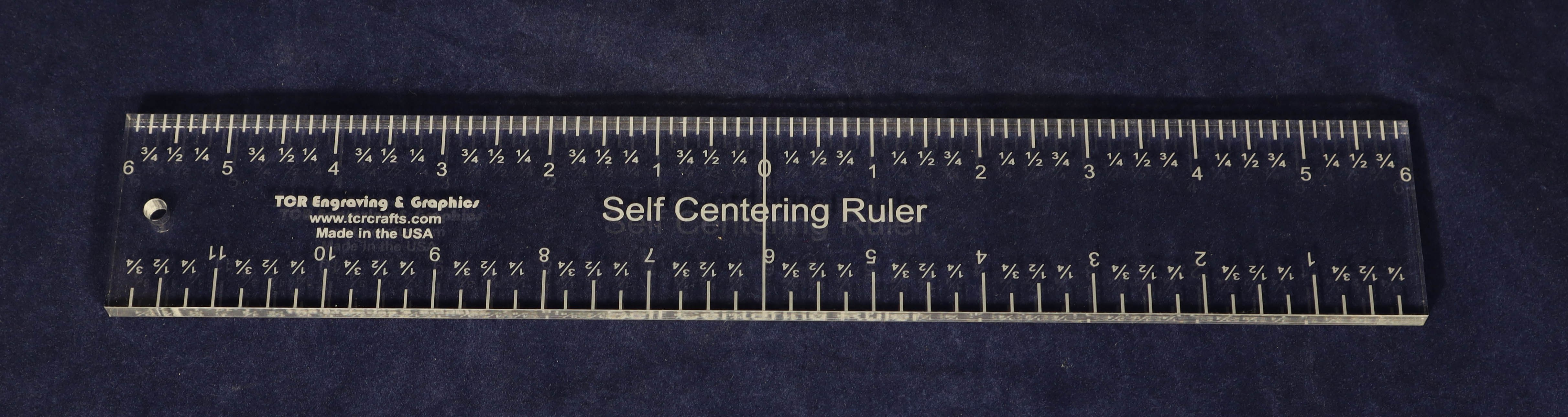 A clear acrylic self-centering quilting ruler on a blue background