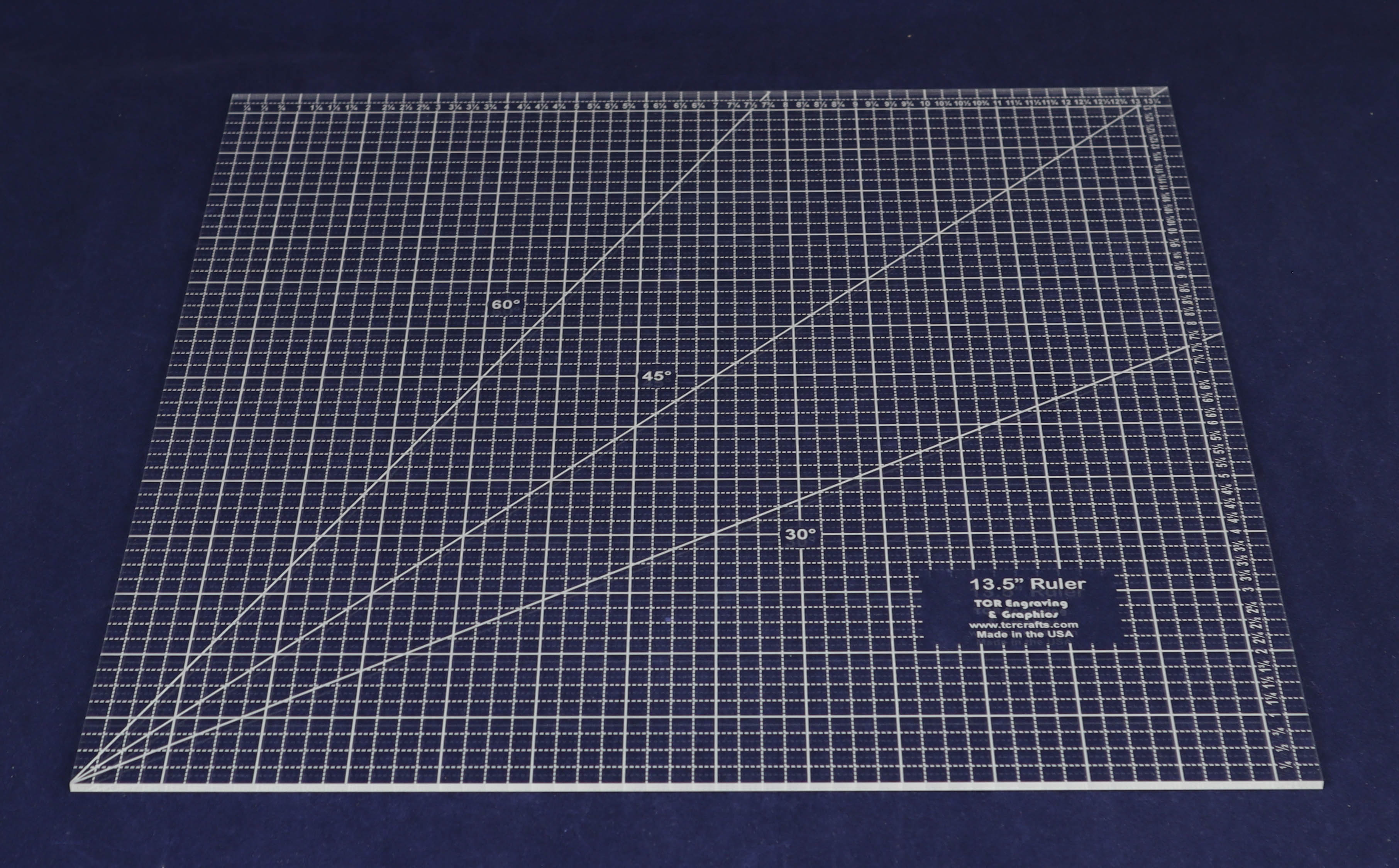 Clear acrylic square quilting ruler on a blue work surface