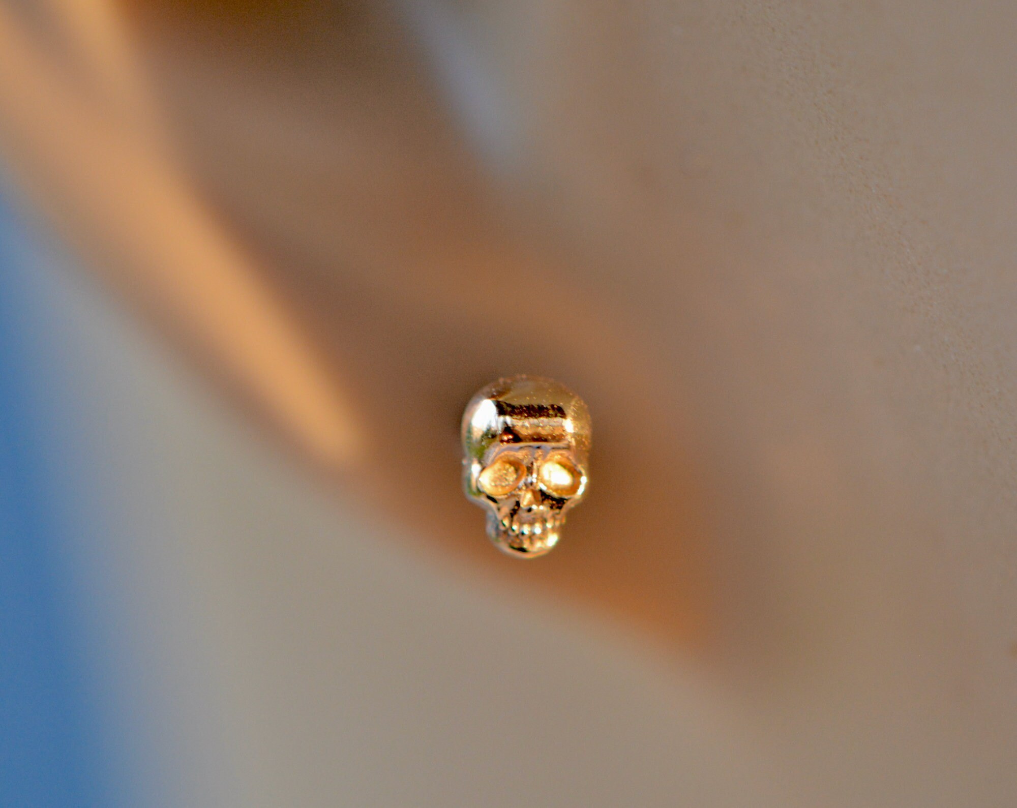 14k Gold Tiny Skull Studs: Memento Mori Earrings, detail view
