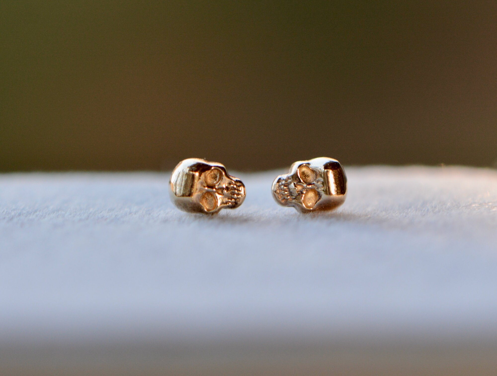 14k Gold Tiny Skull Studs: Memento Mori Earrings, detail view