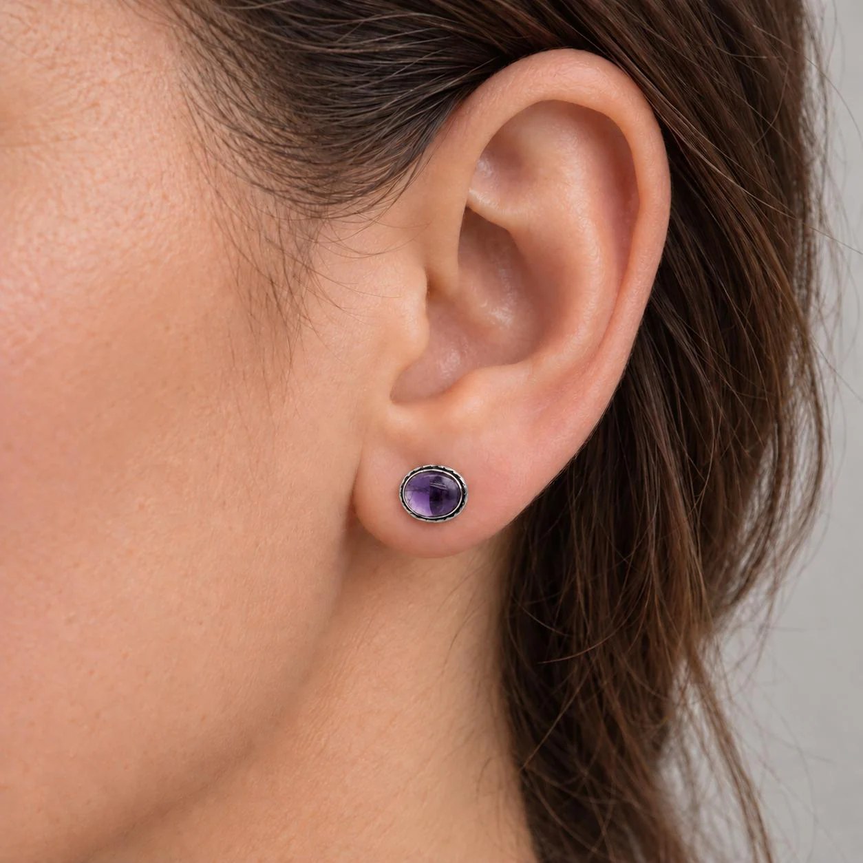 Amethyst Cabochon Oval Stud Earrings in Sterling Silver : February Birthstone, worn view