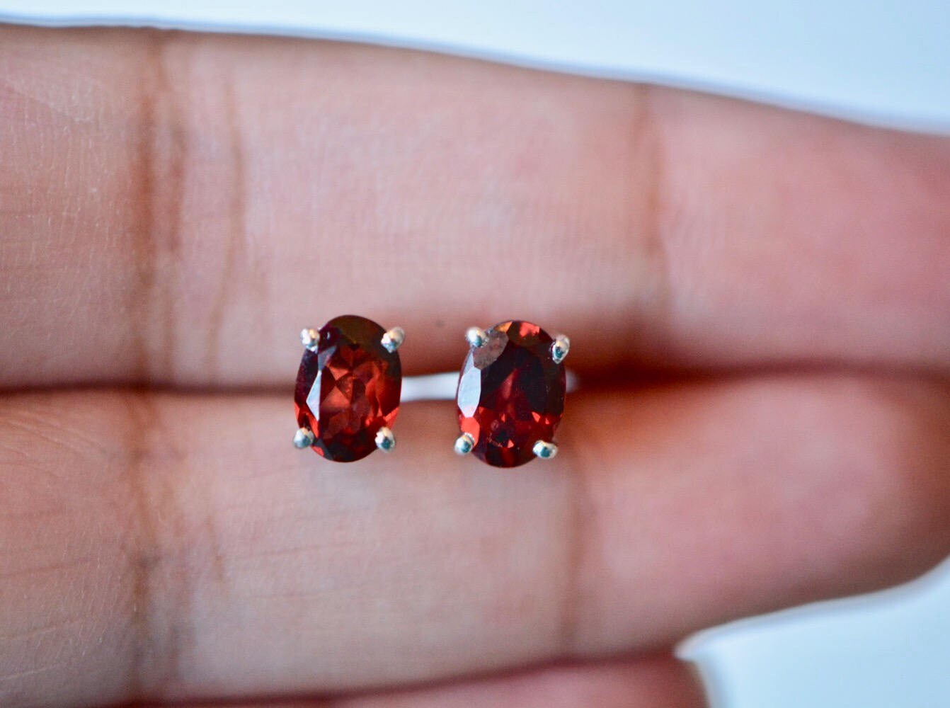 Garnet Oval Stud Earrings Sterling Silver, 7x5mm, detail view