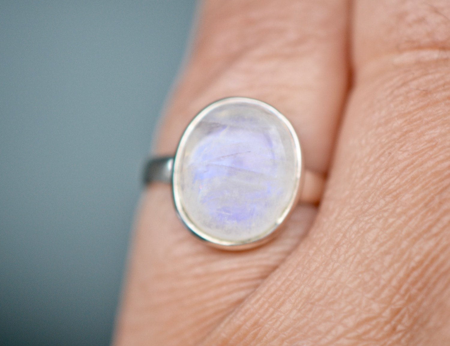Oval Moonstone Cabochon Ring Sterling Silver Size 6, June Birthstone, worn view
