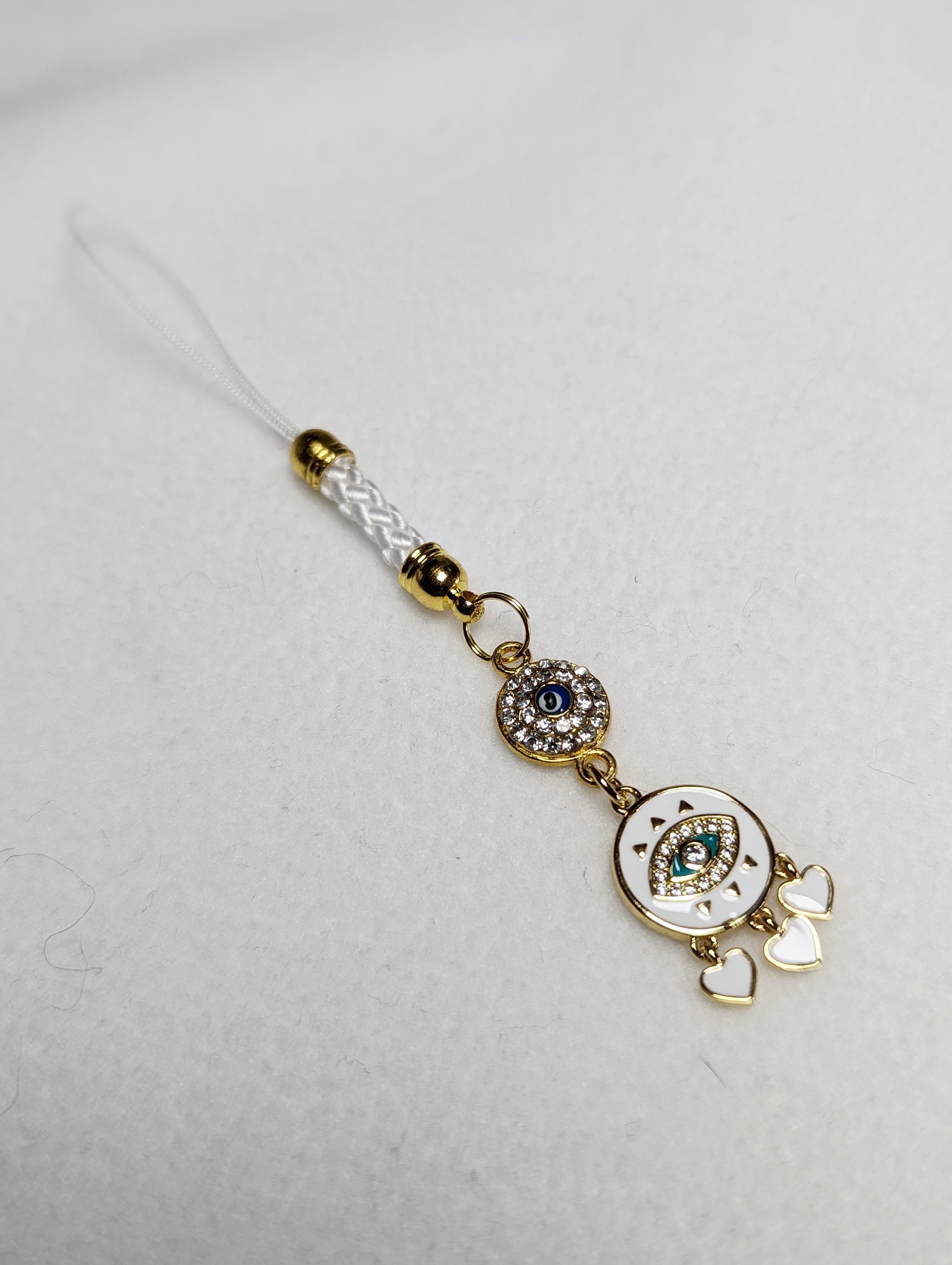 Evil Eye Cell Phone Charm: White Enamel, Zirconia Diamonds, 3 Hearts